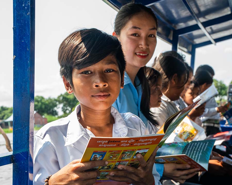 Student on Boat with Book